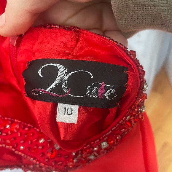 Beautiful open back red prom dress. Detailing is beautiful and only worn twice. - Picture 3 of 4